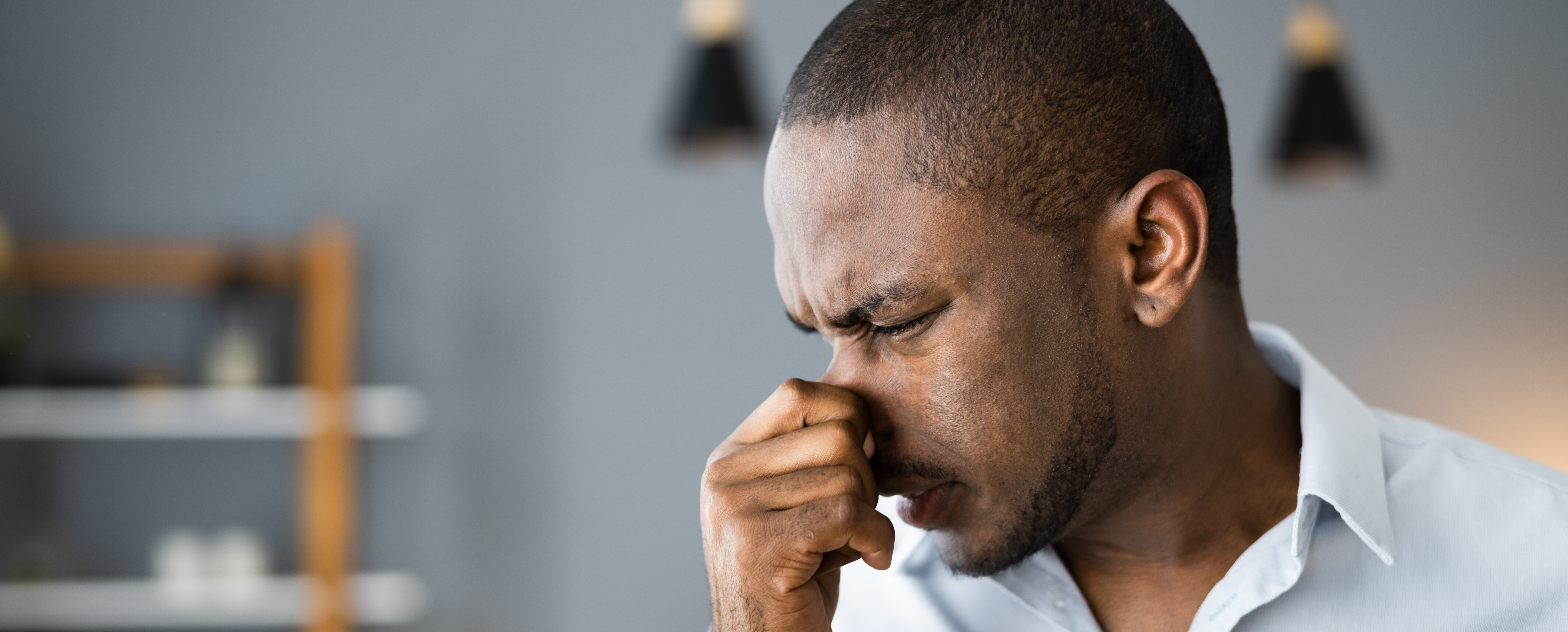 Man Covering His Nose From Bad Smell Inside The House